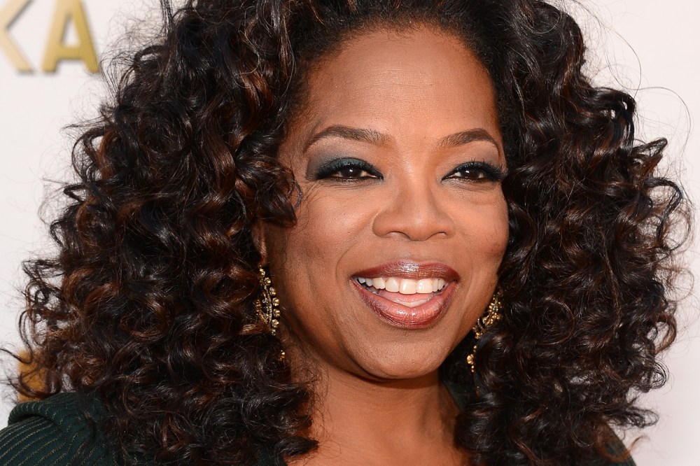 Oprah Winfrey attends the 19th Annual Critics' Choice Movie Awards at Barker Hangar on January 16, 2014 in Santa Monica, California.