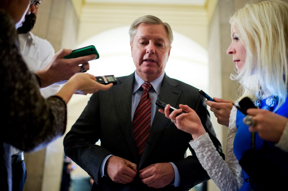 Sen. Lindsey Graham, R-S.C., talks with reporters, Jan. 28, 2014, in Washington.