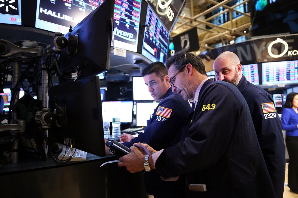 Traders work on the floor of the New York Stock Exchange at the end of the trading day, Feb. 3, 2014 in New York, N.Y.
