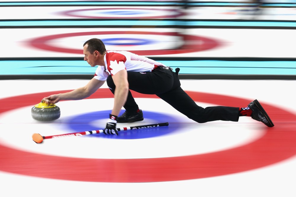E.J. Harnden of Canada in action during a round robin curling match against Germany during day 3 of the Sochi 2014 Winter Olympics at Ice Cube Curling Center on Feb. 10, 2014 in Sochi, Russia.