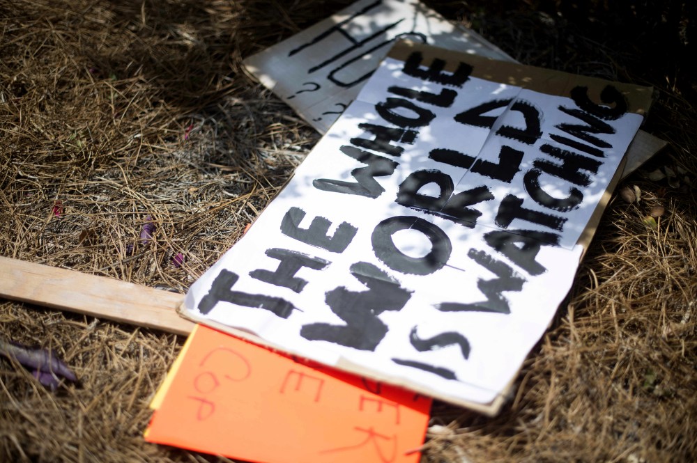 Placards litters the ground after protesters gathered outside the North Charleston City Hall in North Charleston, SC on April 8, 2015. (Photo by Jim Watson/AFP/Getty)