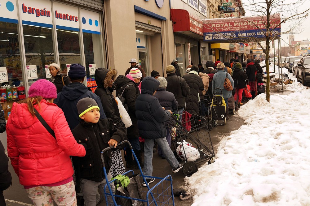 People wait in line for CAMBA's Beyond Hunger Emergency Food Pantry on February 18, 2014 in the Brooklyn borough of New York City.