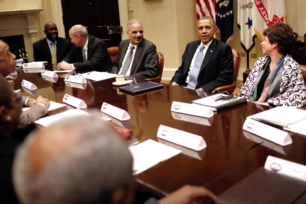 President Barack Obama (2nd R), Attorney General Eric Holder (C) and Senior Advisor to the President Valerie Jarrett (R) meet with leaders from African American civil rights groups an the White House Feb. 18, 2014 in Washington, DC.