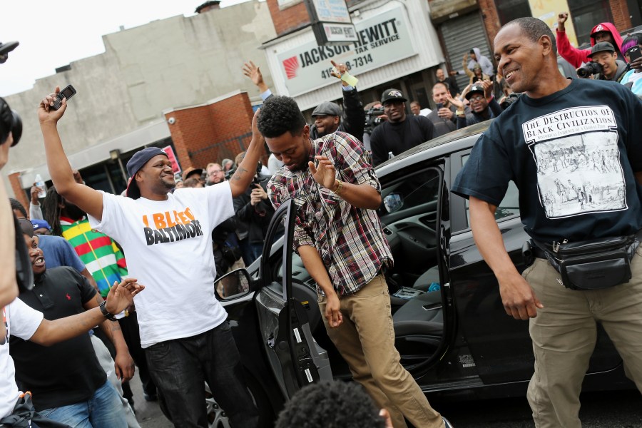People react after Baltimore authorities released a report on the death of Freddie Gray on May 1, 2015 in Baltimore, Md. (Photo by Win McNamee/Getty)