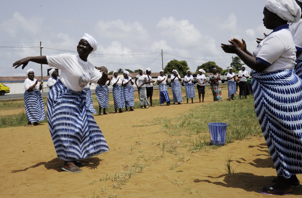 Members of the Women In Peace building Network dance and pray on May 8, 2015 in Monrovia. The World Health Organization (WHO) has declared Liberia "Ebola-free." (Photo by Zoom Dosso/AFP/Getty)