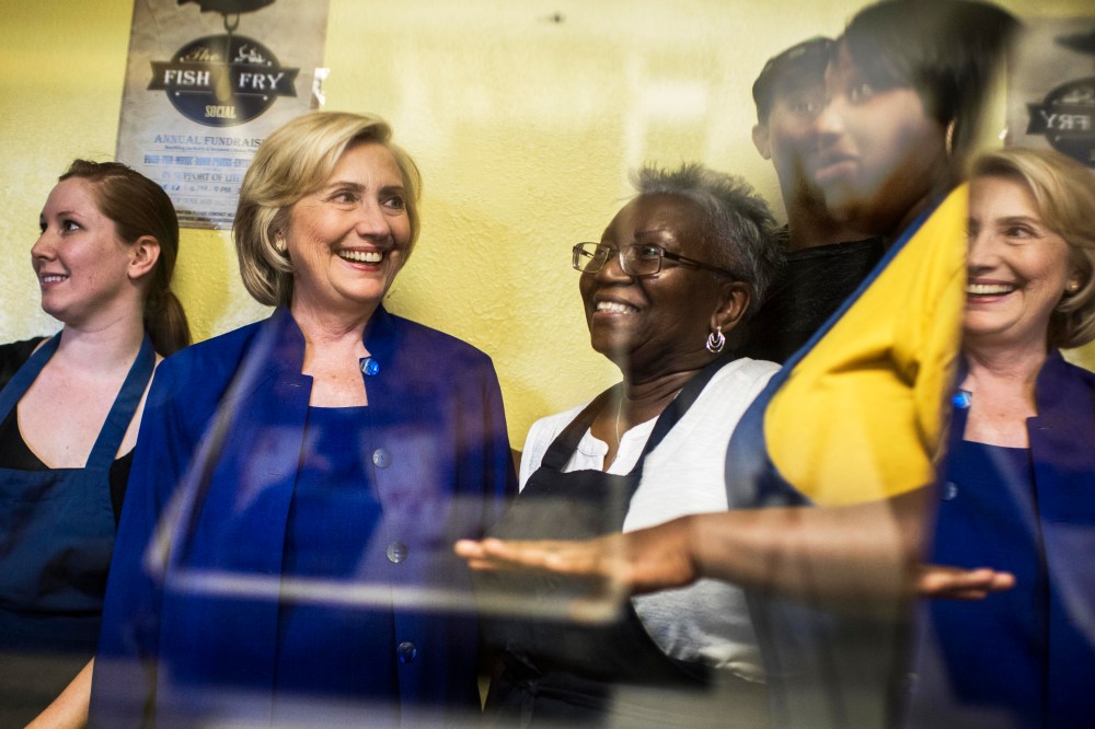 Former Secretary of State Hillary Clinton is shown the special treats at Main Street Bakery by owner Rosa Daniels, right, in Columbia, S.C. on May 27, 2015. (Photo by Melina Mara/The Washington Post/Getty)