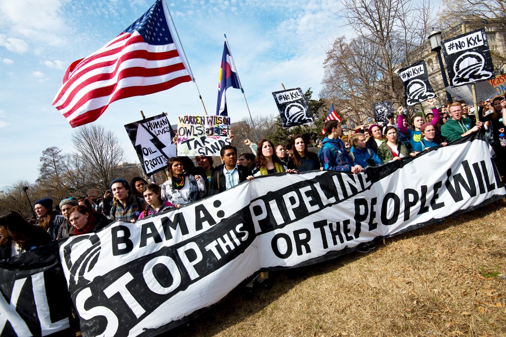 Students protest the proposed Keystone XL pipeline across from the White House, March 2, 2014.