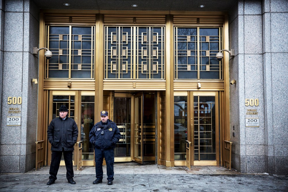 Security guards stand outside Federal Court as the trial for Osama Bin Laden's son-in-law, Sulaiman Abu Ghaith, begins in New York City, Mar. 3, 2014.