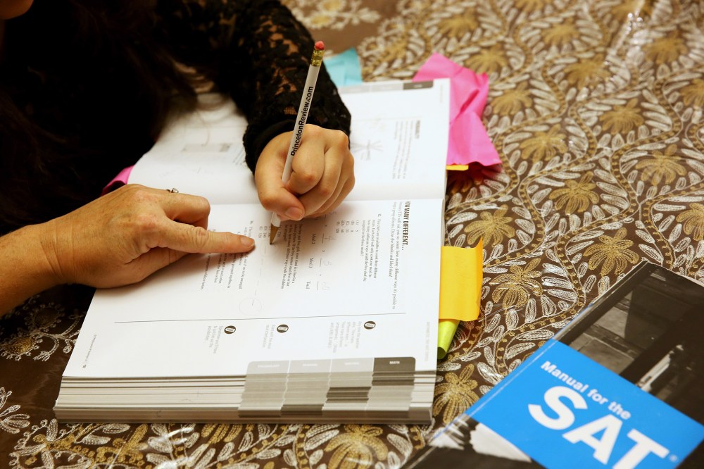 Carol McMullen-Pettit, a Premier Tutor at The Princeton Review, goes over SAT test preparation with 11th grader, Suzane Nazir, in Pembroke Pines, Fla., Mar. 6, 2014.