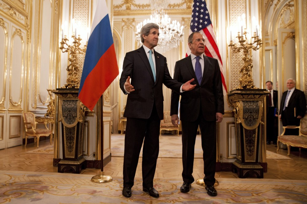US Secretary of State John Kerry (L) gestures next to Russian Foreign Minister Sergey Lavrov (R) at the Russian Ambassador's Residence in Paris, March 30, 2014.