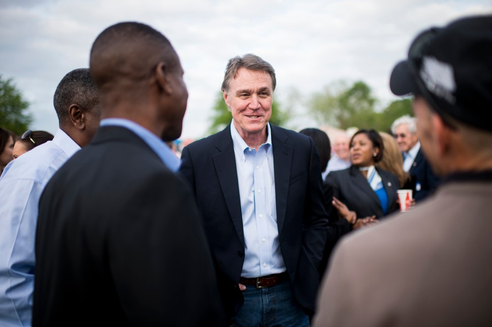 Candidate for U.S. Senate David Perdue speaks with attendees at a Law Enforcement Cookout in Glennville, Ga., on Thursday, April 17, 2014.