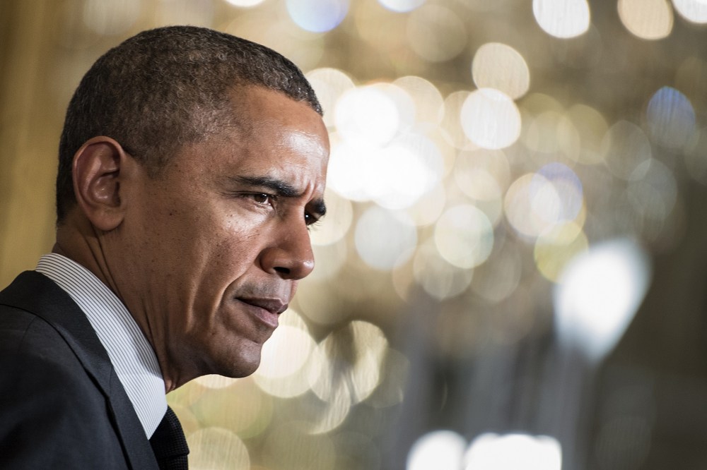 US President Barack Obama pauses while speaking during an event at the White House on April 30, 2014.