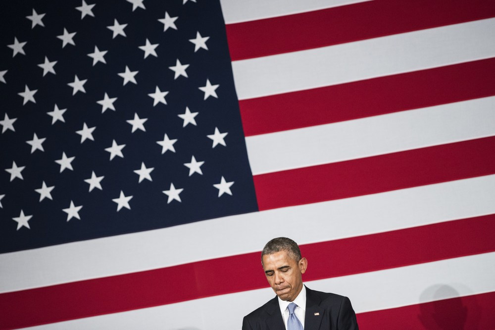 US President Barack Obama pauses while speaking during a reception for the Democratic National Committee May 8, 2014 in in San Jose, Calif.