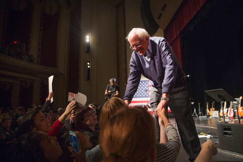 Democratic presidential candidate Senator Bernie Sanders (I-VT) greets guests at an event he was hosting to raise support for his campaign at the Adler Theater on Oct. 23, 2015 in Davenport, Iowa. (Photo by Scott Olson/Getty)