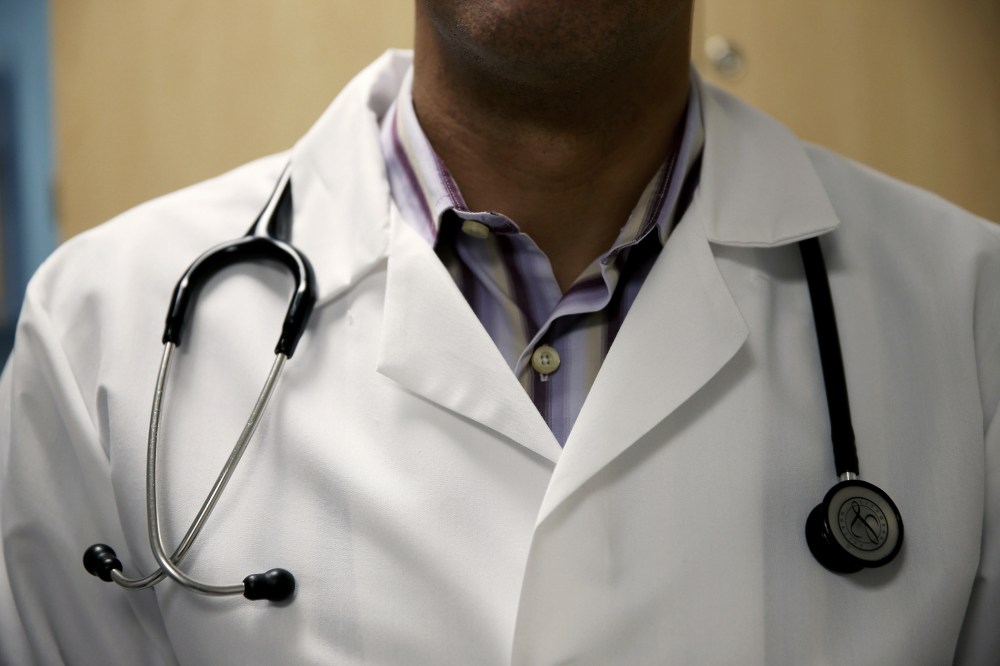 A doctor waits to see a patient. (Photo by Joe Raedle/Getty)