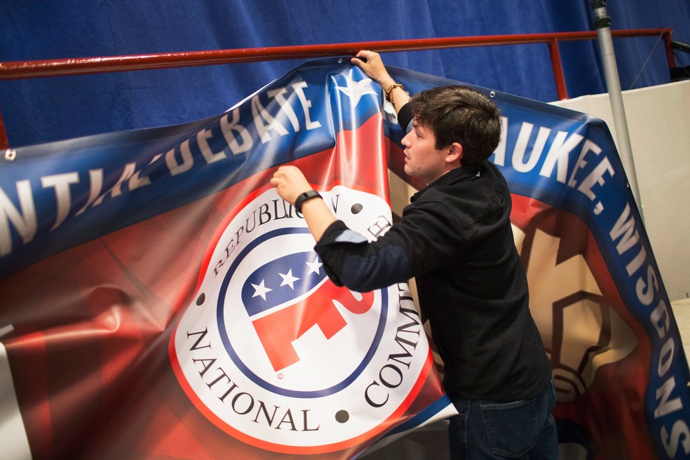Kirt Gallatin helps to prepare for the Republican presidential debate sponsored by Fox Business News and the Wall Street Journal on Nov. 9, 2015 in Milwaukee, Wis. (Photo by Scott Olson/Getty)