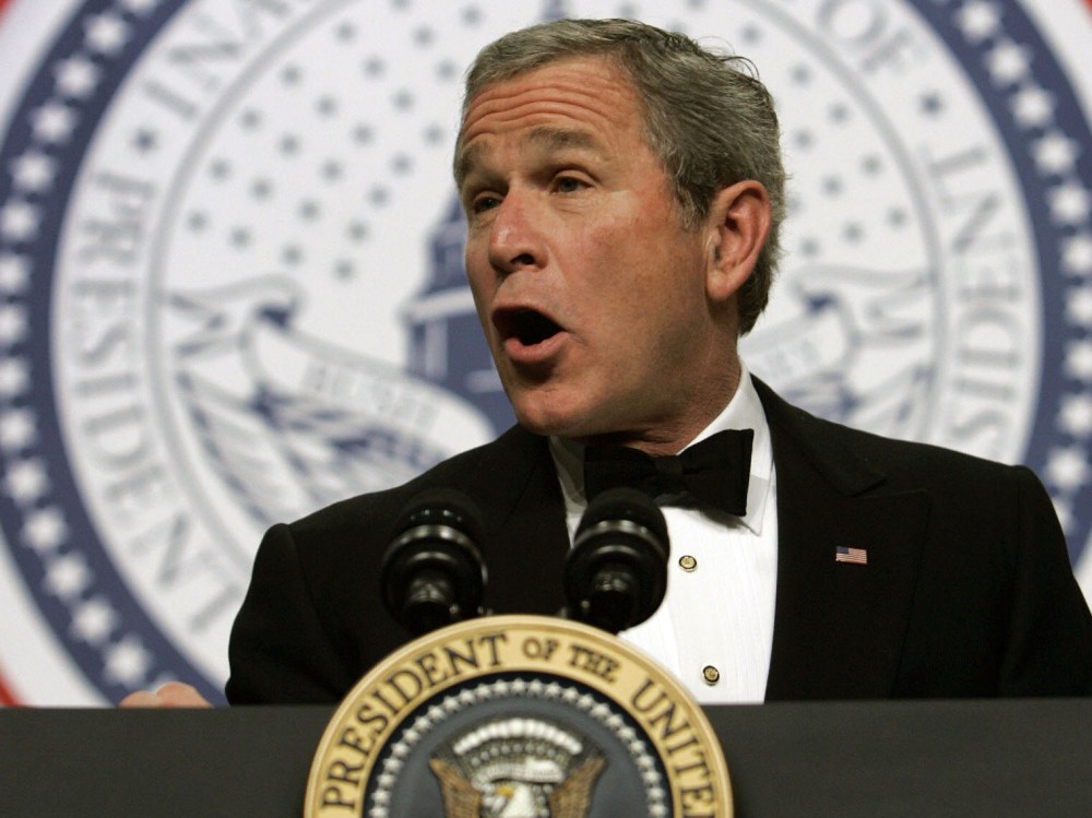File Photo: US President George W. Bush addresses the Texas Wyoming Ball, part of the festivities marking his inauguration for a second term, in Washington 20 January 2005.  (Photo by Brendan Smialowski/AFP/Getty Images, File)