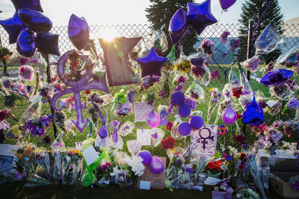 Mementos left by fans are attached to the fence which surrounds Paisley Park, the home and studio of Prince, on April 23, 2016 in Chanhassen, Minn. (Photo by Scott Olson/Getty)