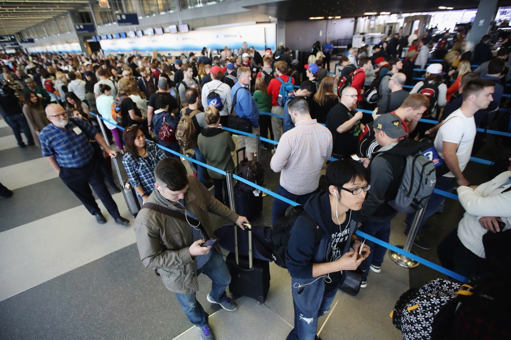 Passengers at O'Hare International Airport wait in line to be screened at a Transportation Security Administration (TSA) checkpoint on May 16, 2016 in Chicago, Ill. (Photo by Scott Olson/Getty)