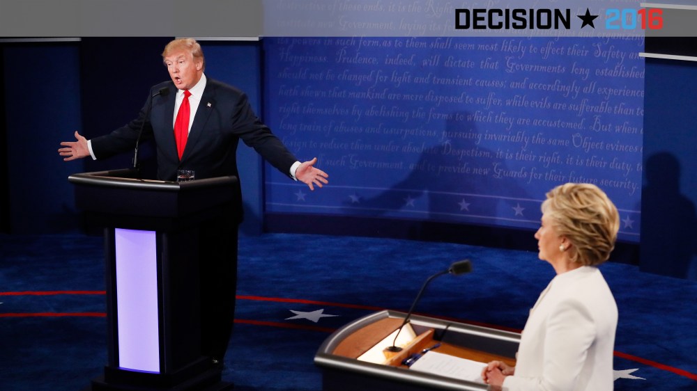Republican presidential nominee Donald Trump speaks as Democratic presidential nominee Hillary Clinton looks on during the third U.S. presidential debate at the Thomas & Mack Center on Oct. 19, 2016 in Las Vegas, Nev. (Photo by Mark Ralston/Pool/Getty)