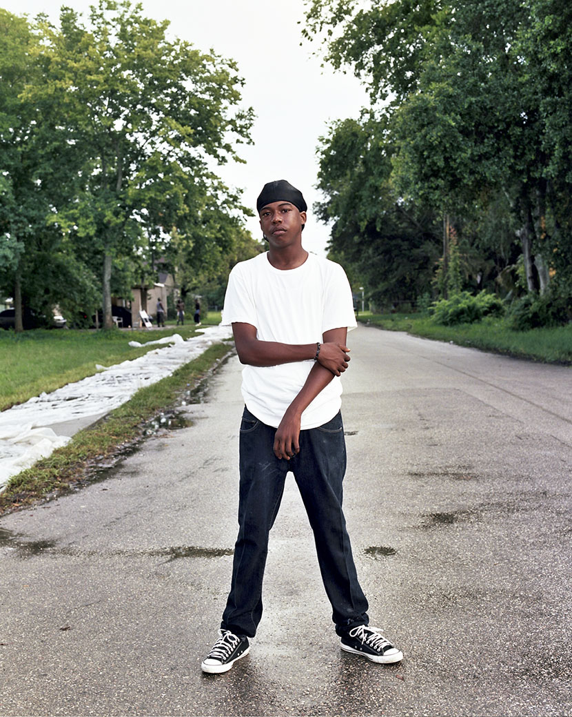 Juwann McCall, 16, stands on the corner of Oleander Ave. and 13th Street on a recent afternoon. McCall said violence in the neighborhood is troubling, but it wasn’t until Trayvon Martin’s death that the community came together. McCall joined in the rallie