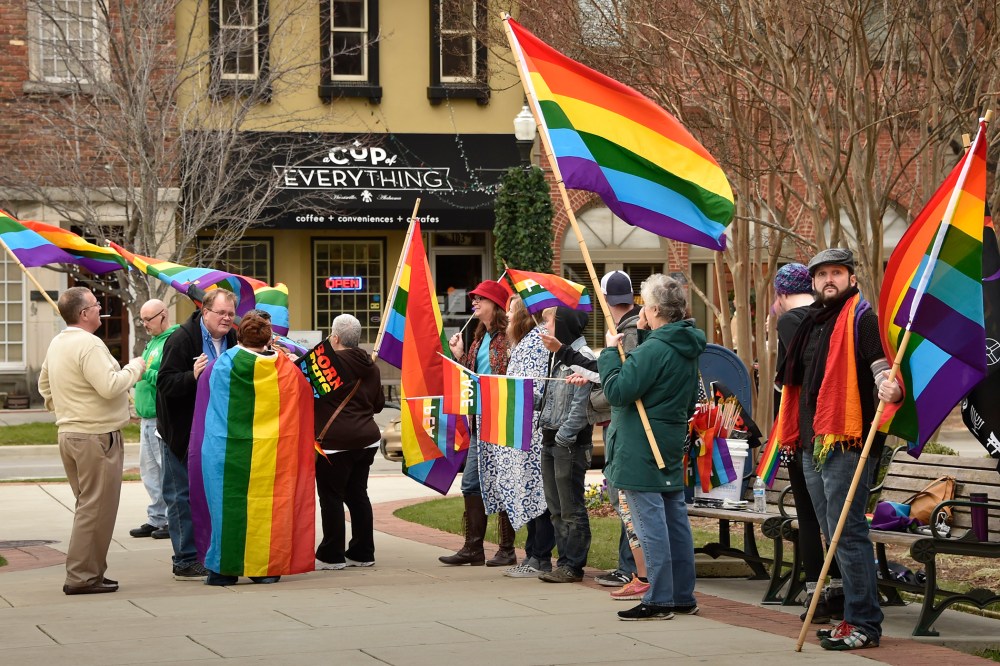A group of same-sex marriage activists gathered outside the Madison County Courthouse to protest Judge Roy Moore's statements, Jan. 6, 2016, Ala. (Photo by Bob Gathany/AL.com/Landov)