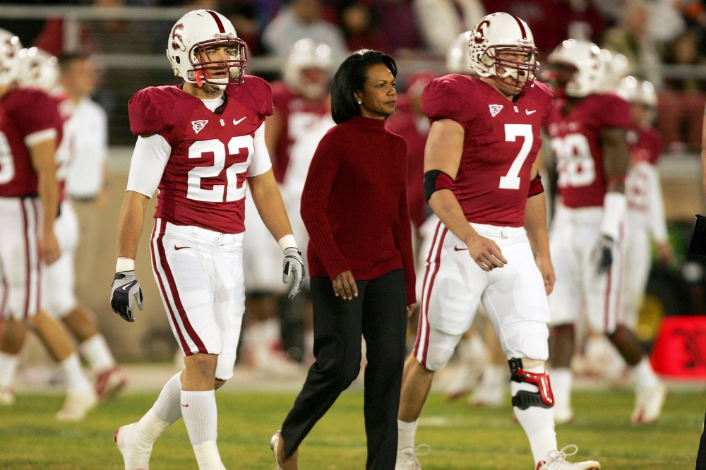 Honorary Stanford captain Condoleezza Rice walks to the middle of the field for the coin toss before their game against at Stanford Stadium on Nov. 28, 2009 in Palo Alto, Calif.