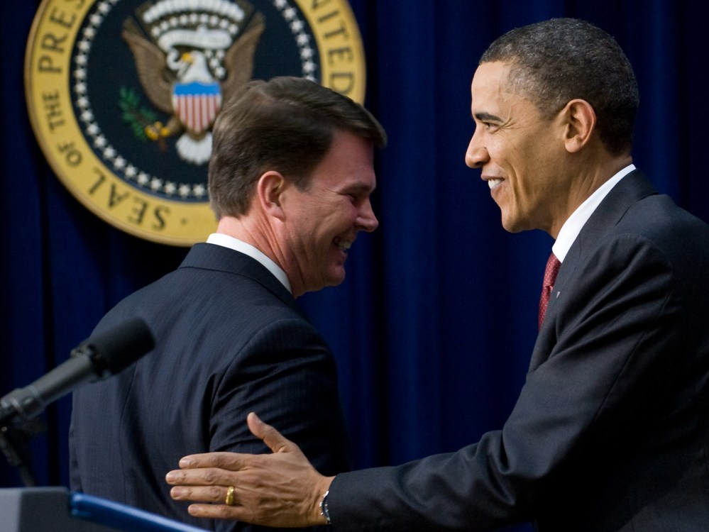 File Photo: US President Barack Obama shakes hands with Office of Personnel Management Director John Berry (L) before speaking during the closing session of the Forum for Workplace Flexibility in the South Court Auditorium in the Eisenhower Executive...