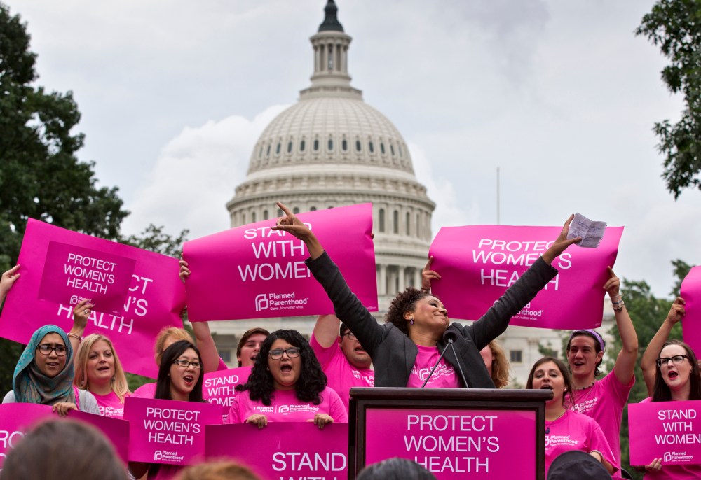Women rally on Capitol Hill in Washington, Thursday, July 11, 2013.