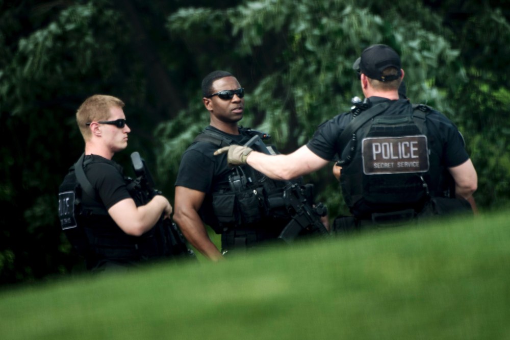 Heavily armed members of the Secret Service patrol on the North Lawn of the White House during a security lockdown April 26, 2016 in Washington, DC. (Photo by Brendan Smialowski/AFP/Getty)