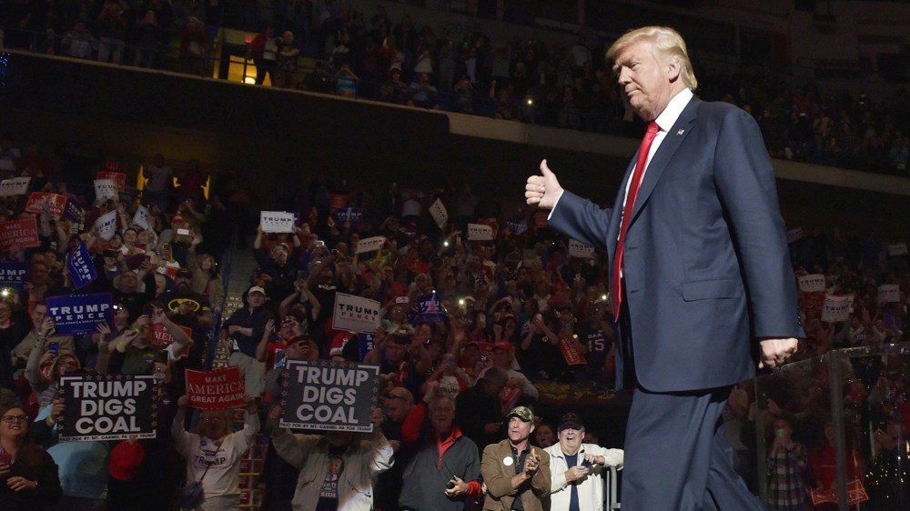 Republican presidential nominee Donald Trump arrives on stage for a rally in Wilkes-Barre, Pa. on Oct. 10, 2016. (Photo by Mandel Ngan/AFP/Getty)