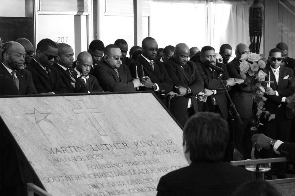 Members of the Alpha Phi Alpha fraternity, Dr. Martin Luther King Jr.'s college fraternity, participate in a candlelight vigil to commemorate the 46th Anniversary of the assassination of King in front of the National Civil Rights Museum, April 4, 2014, in