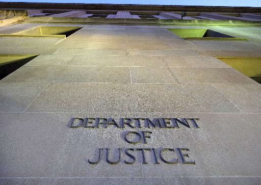 The Department of Justice headquarters building in Washington is photographed early in the morning Tuesday, May 14, 2013. (AP Photo/J. David Ake)
