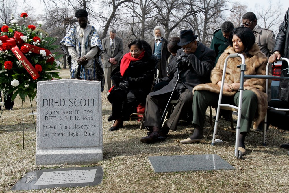 Descendants of Dred Scott and others gather at his grave site, in a, March 6, 2007 photo, at Calvary Cemetery in St. Louis, Mo.