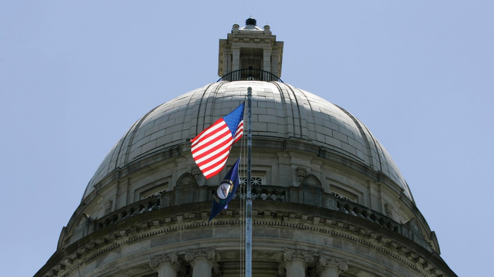 The American flag flies in front of the Capitol Rotunda in Frankfort, Ky.