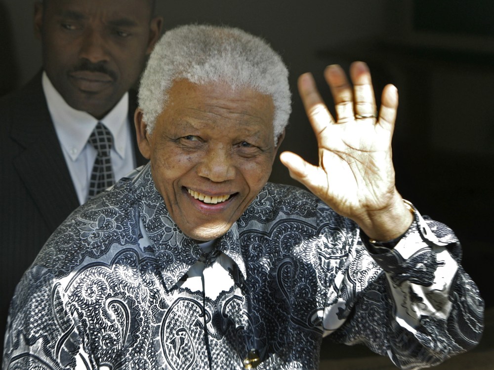 File Photo: Former South African President Nelson Mandela waves during The Mandela Rhodes Foundation  90th birthday celebration for the former president at one of his residence in Cape Town, South Africa, Wednesday, Aug. 20, 2008. (Photo by Schalk van...