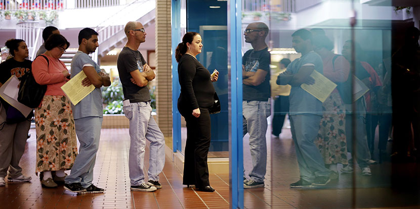 Voters wait in line at a polling place located inside a shopping mall, on Election Day, Tuesday, Nov. 6, 2012, in Austin, Texas. (Photo by Eric Gay/AP)