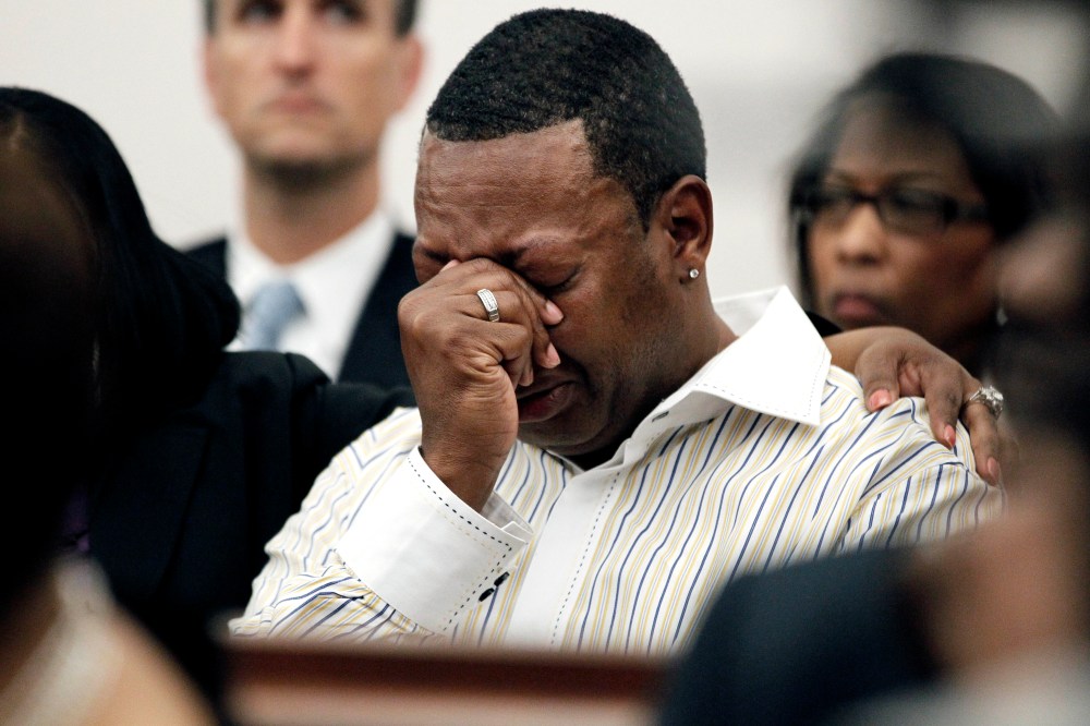 A family member cries as Barbara Anderson Young, sister of James Craig Anderson, reads a statement in Hinds County Circuit Court, March 21, 2012 in Jackson, Miss. (Photo by Rogelio V. Solis/AP)