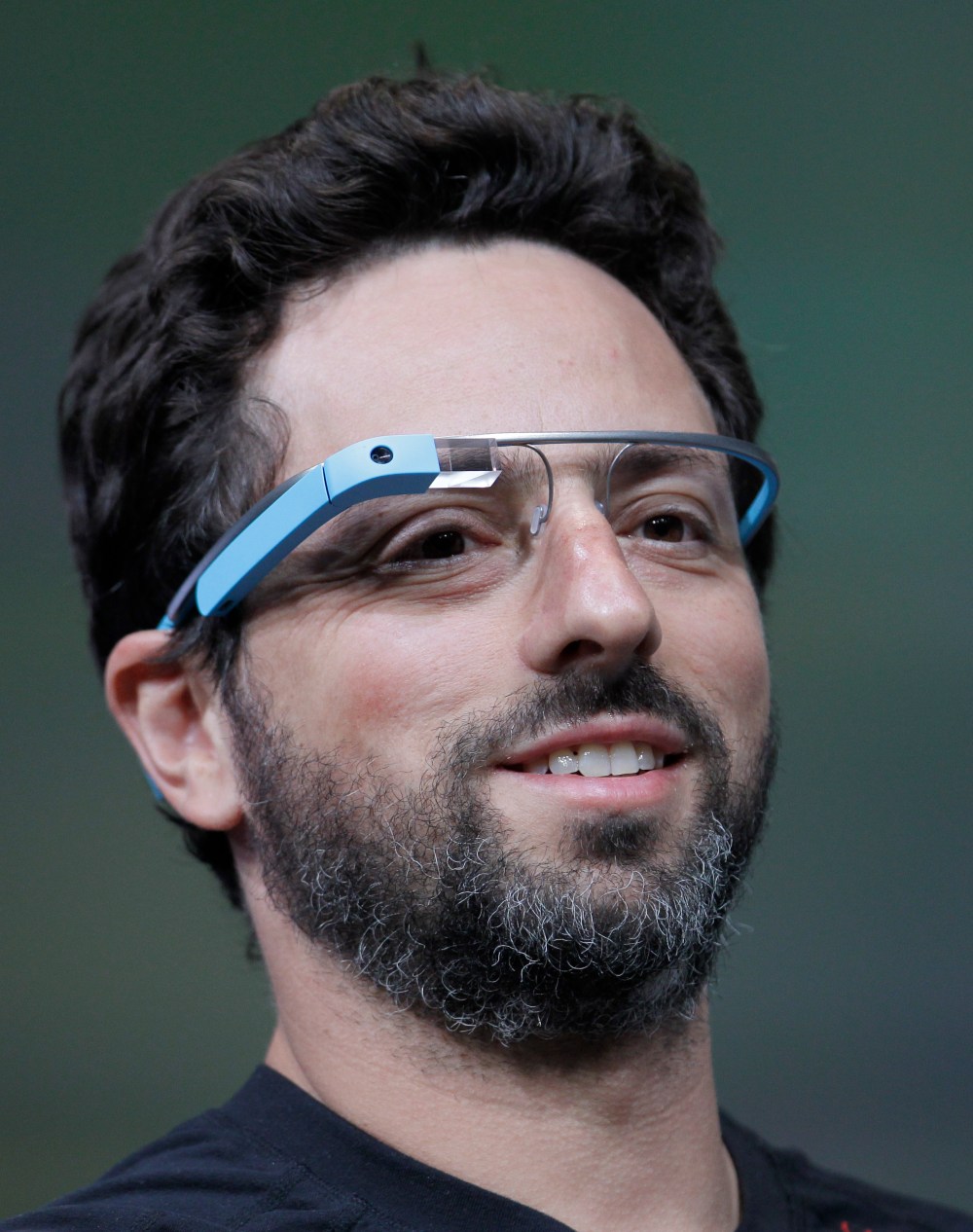 Google co-founder Sergey Brin demonstrates Google's new Glass, wearable internet glasses, at the Google I/O conference in San Francisco, Wednesday, June 27, 2012.  (AP Photo/Paul Sakuma)