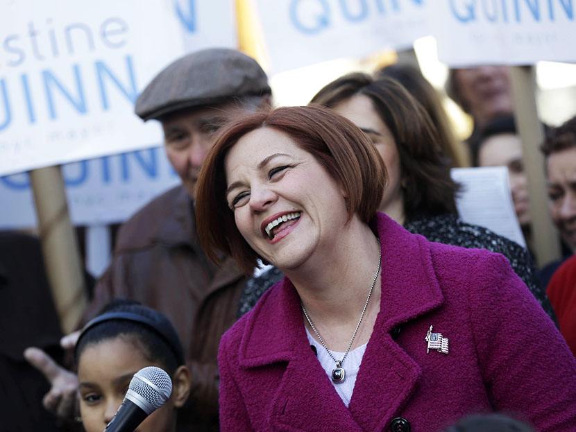 Surrounded by family and supporters, New York City Council speaker and mayoral hopeful Christine Quinn, center, laughs while speaking to the media as she announces her mayoral run in New York, Sunday, March 10, 2013. (Photo by Seth Wenig/AP)