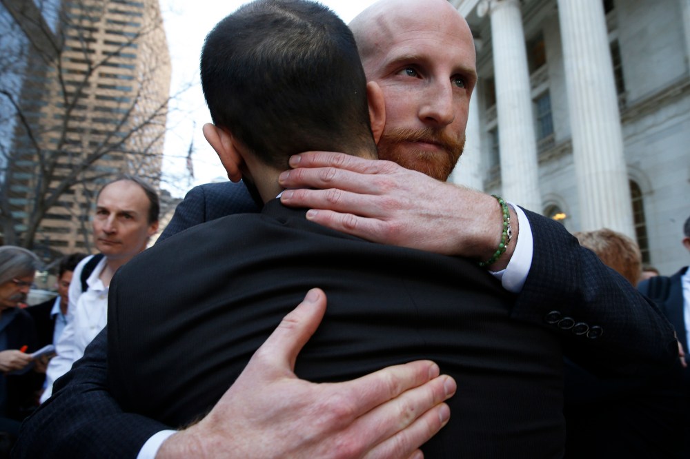 Derek Kitchen, right, and his partner Moudi Sbeity, the plaintiffs challenging Utah's gay marriage ban, hug after leaving court following a hearing at the U.S. Circuit Court of Appeals in Denver, April 10, 2014.