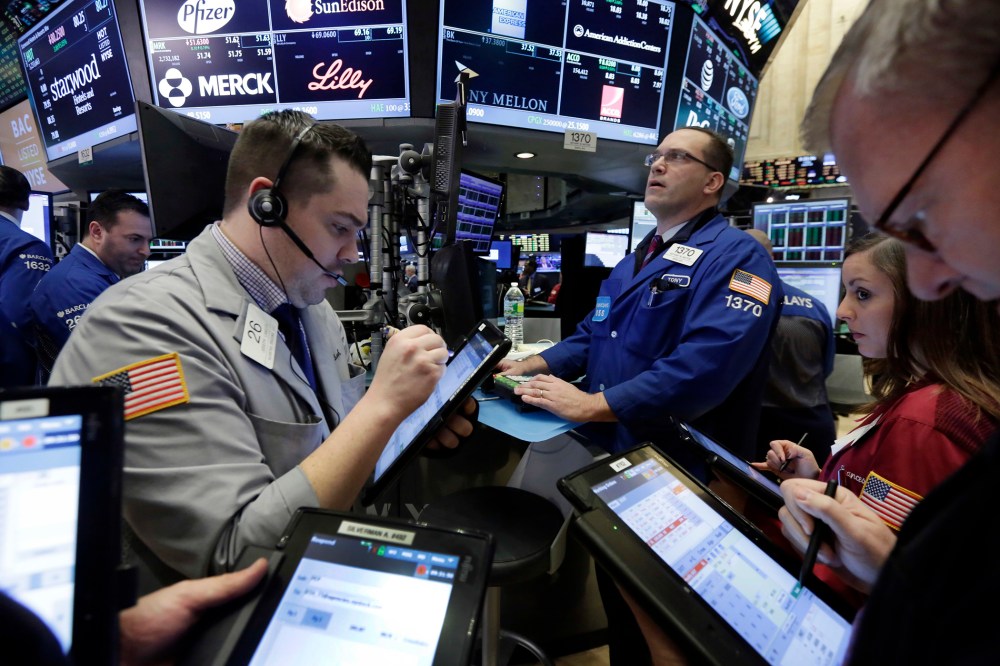 Traders on the floor of the N.Y. Stock Exchange, March 18, 2016. U.S. stocks opened higher again, setting the market up to extend its winning streak to a fifth week and erasing most of the year's early losses. (Photo by Richard Drew/AP)