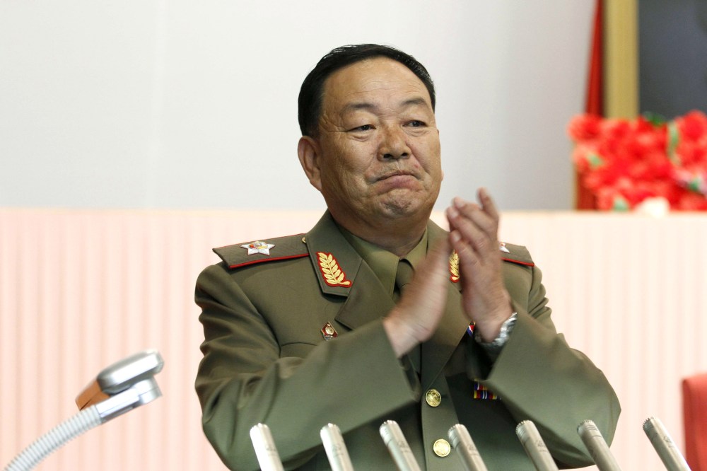Vice Marshal Hyon Yong Chol applauds during a meeting at the April 25 House of Culture announcing North Korean leader Kim Jong Un's new title of marshal, July 18, 2012, in Pyongyang, North Korea. (Photo by Jon Chol Jin/AP)