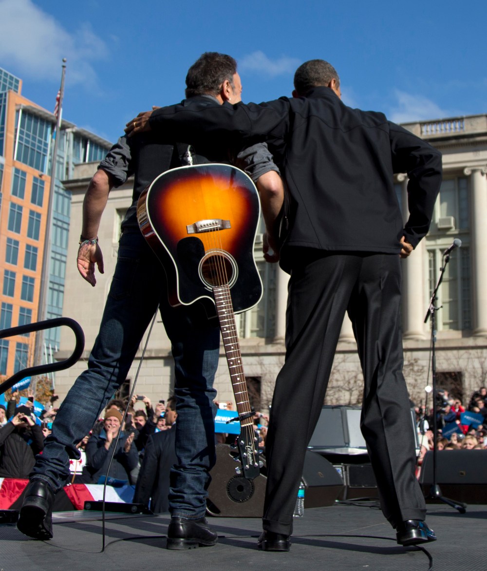 President Barack Obama and singer Bruce Springsteen stand together on stage during a campaign event, Monday, Nov. 5, 2012, in downtown Madison, Wis. (AP Photo/Carolyn Kaster)