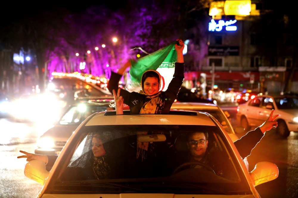 Iranians celebrate on a street in northern Tehran, Iran, April 2, 2015, after Iran's nuclear agreement with world powers in Lausanne, Switzerland. (Photo by Ebrahim Noroozi/AP)