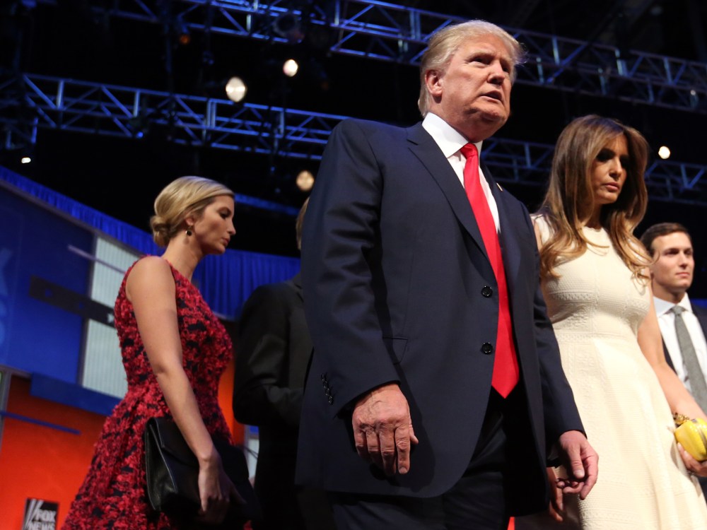 Republican presidential candidate Donald Trump leaves the stage with his wife Melania Trump and his daughter, Ivanka Trump. after the first Republican presidential debate, Aug. 6, 2015, in Cleveland. (Photo by Andrew Harnik/AP)