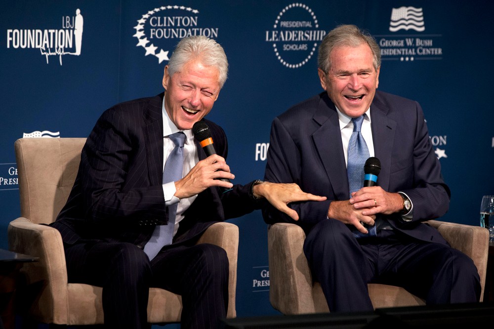 Former Presidents Bill Clinton, left, and George W. Bush, laugh while participating in the Presidential Leadership Scholars Program Launch, Sept. 8, 2014, at The Newseum in Washington, D.C. (Photo by Jacquelyn Martin/AP)
