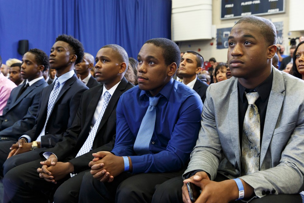 A group of young men listen as President Barack Obama speaks about the My Brother's Keeper Initiative, at the Walker Jones Education Campus in Washington, D.C., July 21, 2014.