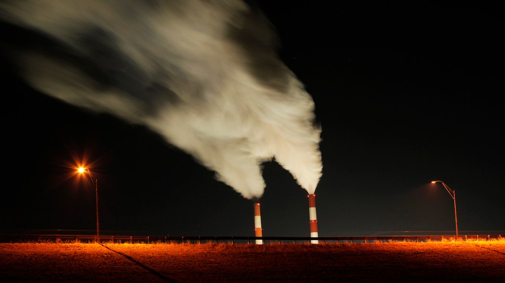 In this Jan. 19, 2012 file photo, smoke rises in this time exposure image from the stacks of a coal-fired power plant in La Cygne, Kan. (Photo by Charlie Riedel/AP)