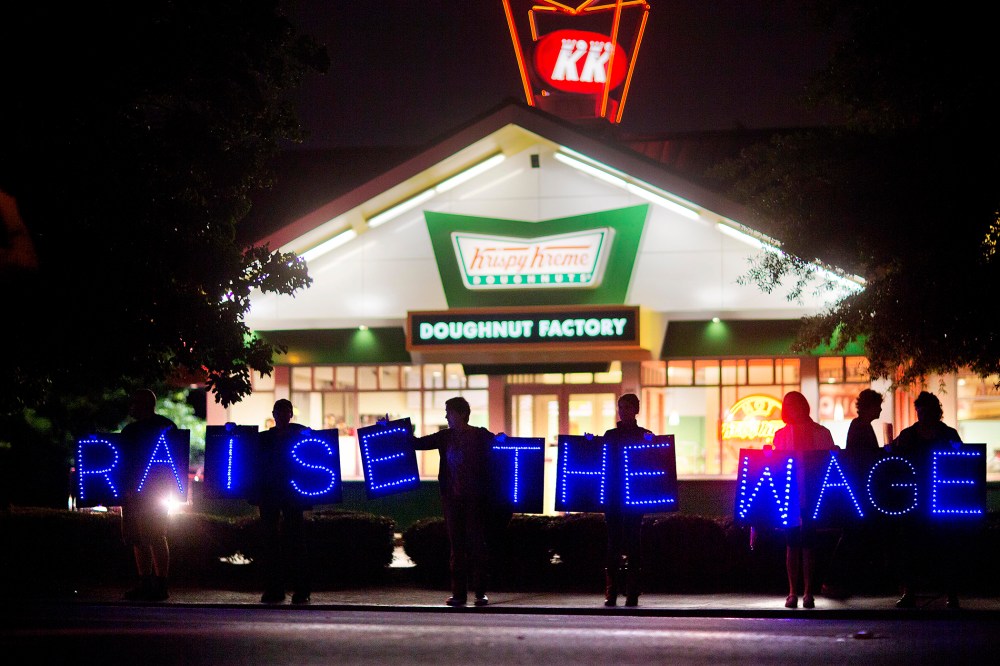 Fast food workers and supporters protest low wages outside a Krispy Kreme store, May 15, 2014, in Atlanta, Ga. (Photo by David Goldman/AP)